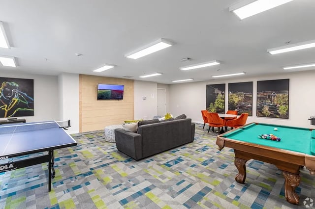 Ping pong table pool table seating living room at Meadowbrook Gardens