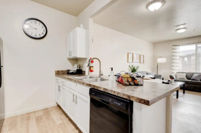 Kitchen island sink and living room view at The Gates in Rexburg Student Accommodation