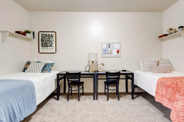 Two beds two desks and chairs bedroom at The Gates in Rexburg Student Accommodation