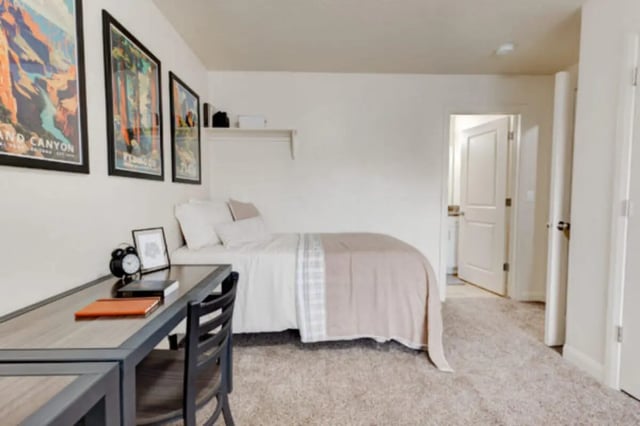 Desk bed framed art and chair bedroom at The Gates in Rexburg Student Accommodation