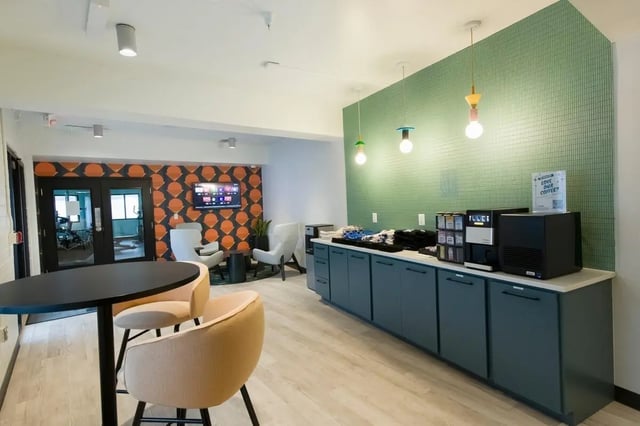 Coffee station and lounge area with modern furniture. at The Gates in East Lansing Student Accommodation