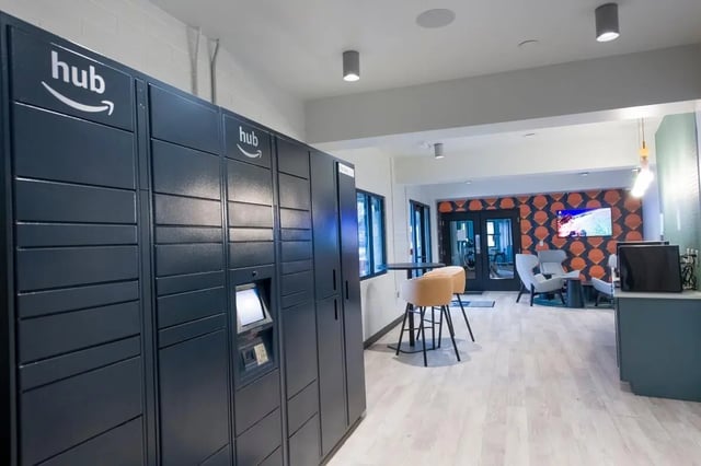 Package lockers and seating area communal space at The Gates in East Lansing Student Accommodation