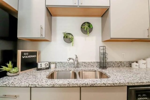 Sink calendar plants and cabinets kitchen at The Green on Campus Drive in Orem Student Accommodation