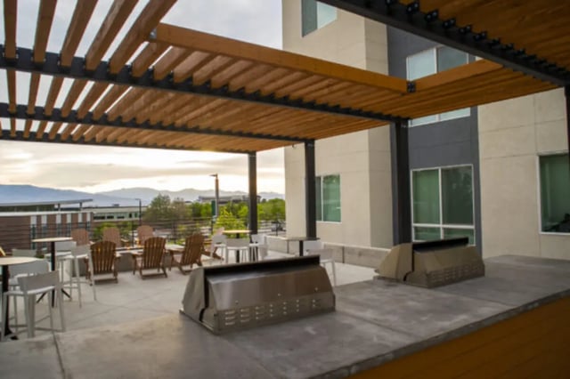 Outdoor patio with grills seating and tables exterior at The Green on Campus Drive in Orem Student Accommodation