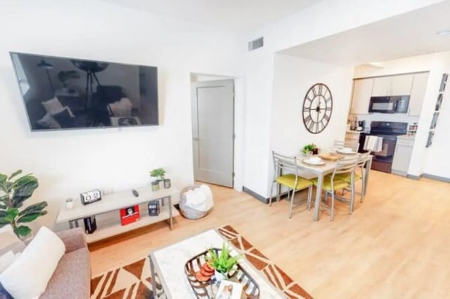 TV dining table and kitchen living room at The Green on Campus Drive - Building 4 in Orem Student Accommodation