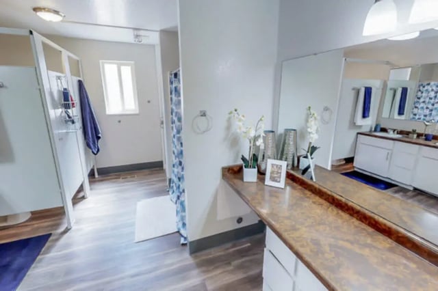 Shower stalls vanity sink and mirror bathroom at Stadium150 Apartments in Provo Student Accommodation
