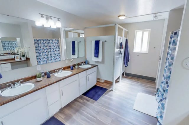 Double sinks shower stall and window Bathroom at Stadium150 Apartments in Provo Student Accommodation