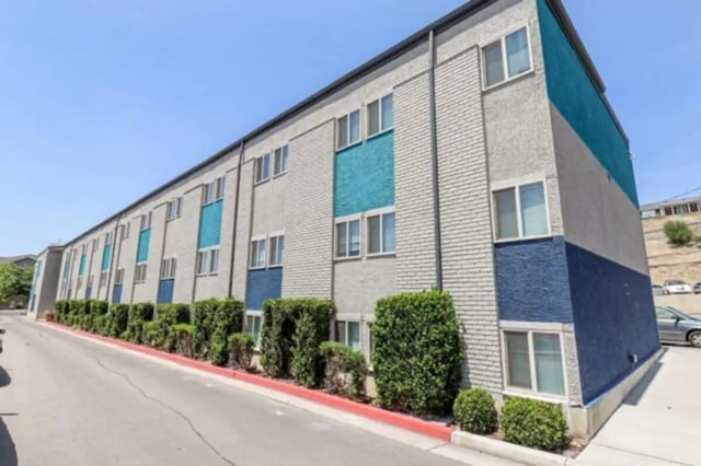 Building with blue accents and windows exterior at Stadium150 Apartments in Provo Student Accommodation