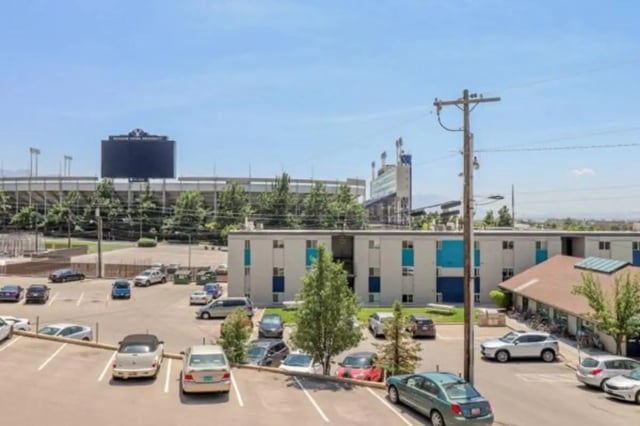 Apartment building with parking lot exterior at Stadium150 Apartments in Provo Student Accommodation