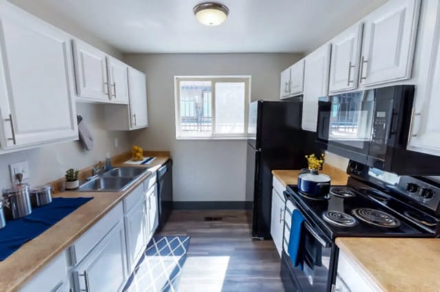 White cabinets stainless steel sink kitchen at Stadium150 Apartments in Provo Student Accommodation