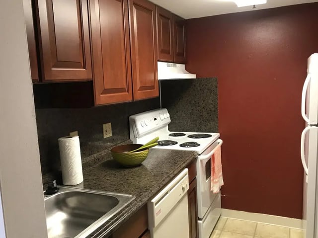 Sink stove refrigerator cabinets paper towel kitchen at Park Place Apartments in Provo Student Accommodation