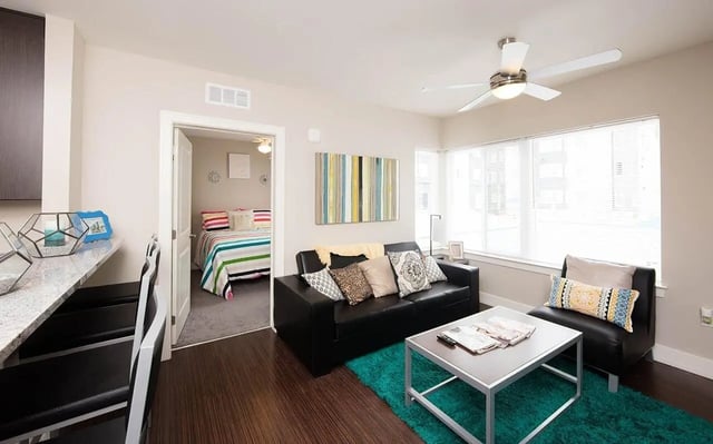 Sofa bed coffee table and bedroom living room at Park Place Columbia in Columbia Student Accommodation