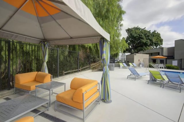 Outdoor seating lounge chairs pool area exterior at Mustang Village Apartments in San Luis Obispo Student Accommodation