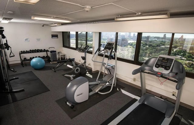 Treadmill elliptical stationary bike weights yoga ball gym at Chateau Student Housing Co-op in Minneapolis Student Accommodation
