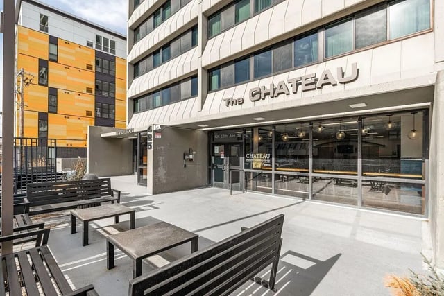 Benches and tables on patio exterior at Chateau Student Housing Co-op in Minneapolis Student Accommodation