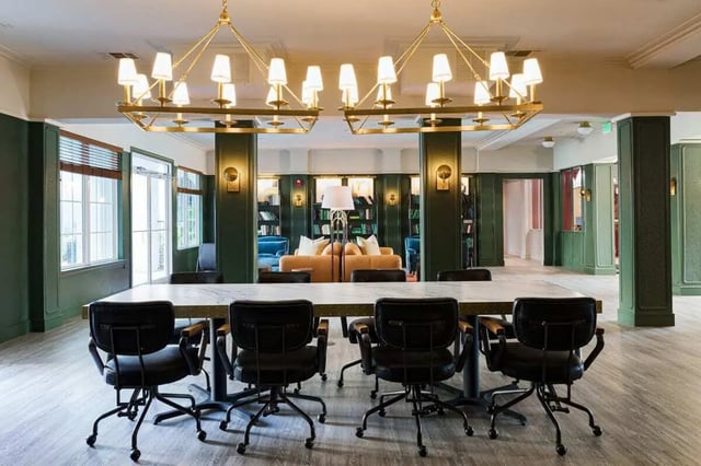 Large table and chairs in a library lounge at 4050 Lofts in Tampa Student Accommodation