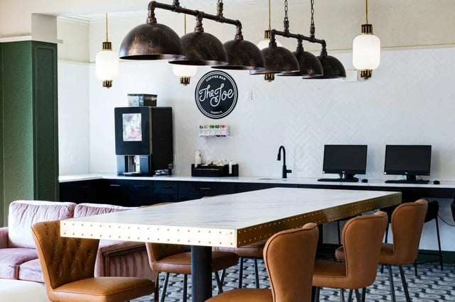 Coffee machine lounge seating computers workspace common area at 4050 Lofts in Tampa Student Accommodation