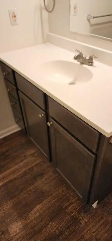 Sink cabinet faucet countertop flooring bathroom at Baylor Plaza III in Waco Student Accommodation