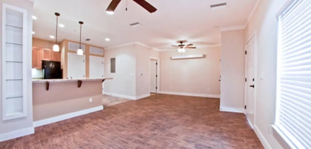 Bar area with cabinets refrigerator and living area living room at Archstone Luxury Apartments in Gainesville Student Accommodation