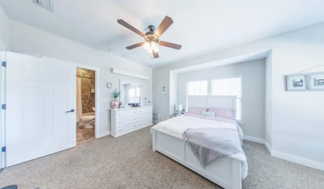White bed dresser and bathroom open Bedroom at Archstone Luxury Apartments in Gainesville Student Accommodation
