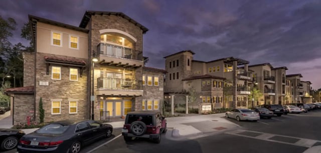 Apartment buildings with balconies and cars exterior at Archstone Luxury Apartments in Gainesville Student Accommodation