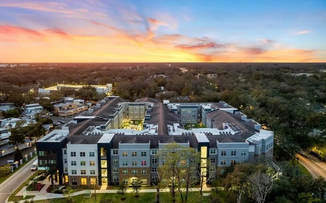 Modern apartment complex with sunset sky exterior at Halo 46 Apartments in Tampa Student Accommodation