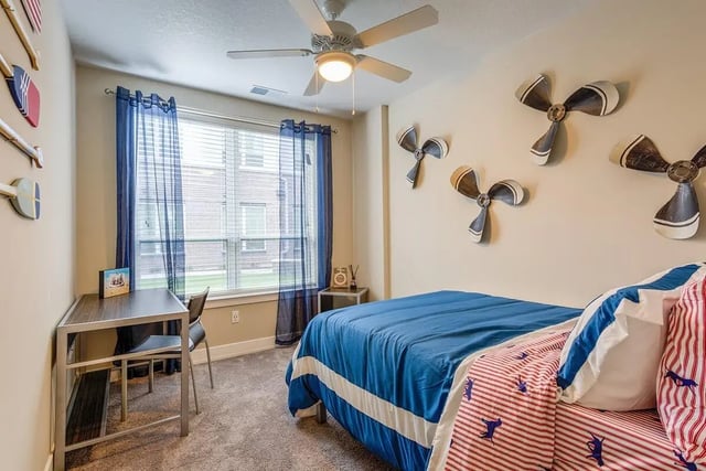 Desk bed window airplane decor bedroom at Park Place Baton Rouge in Baton Rouge Student Accommodation