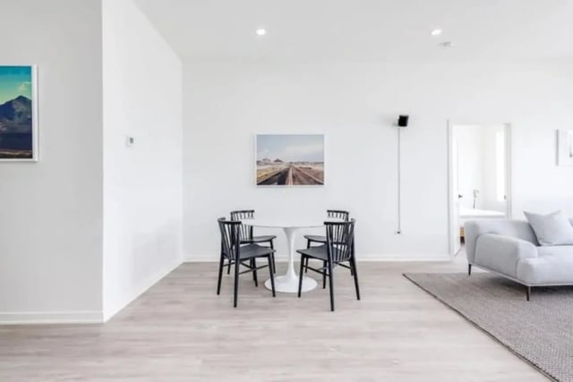 Round table with four black chairs Living Room at Addams Coliving in Chicago Student Accommodation