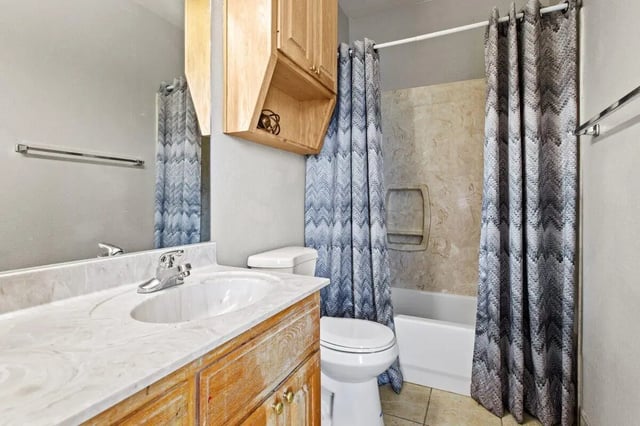 Sink toilet shower curtain and vanity bathroom at Bear Crossing Apartments in Waco Student Accommodation