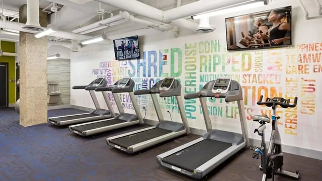 Treadmills and exercise bike fitness room at Varsity on K Apartments in Washington Student Accommodation