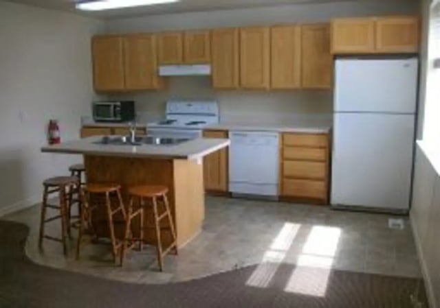 Kitchen island dishwasher refrigerator cabinets stove kitchen at Brighton Private Housing in Rexburg Student Accommodation