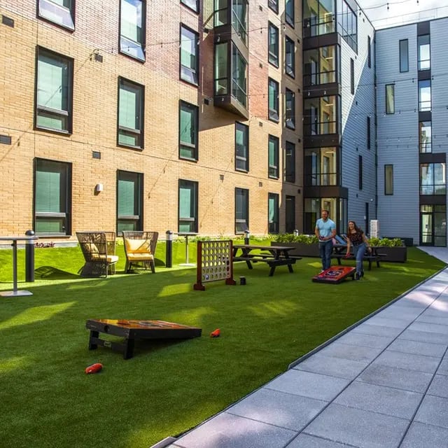Yard with games tables and chairs exterior at 505 on Walnut Apartments in Syracuse Student Accommodation