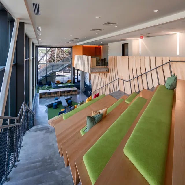 Tiered seating with cushions common area at 505 on Walnut Apartments in Syracuse Student Accommodation