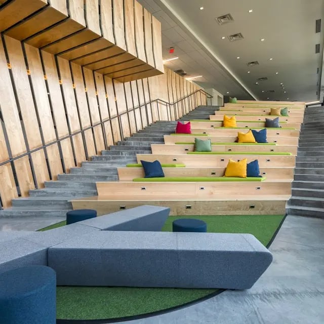 Tiered seating with colorful cushions study area at 505 on Walnut Apartments in Syracuse Student Accommodation