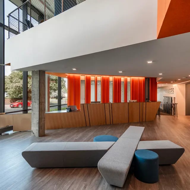 Modern reception area with unique seating lobby at 505 on Walnut Apartments in Syracuse Student Accommodation
