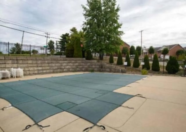 Covered pool with chairs outside pool area at Ashley Oaks Apartments in Morgantown Student Accommodation