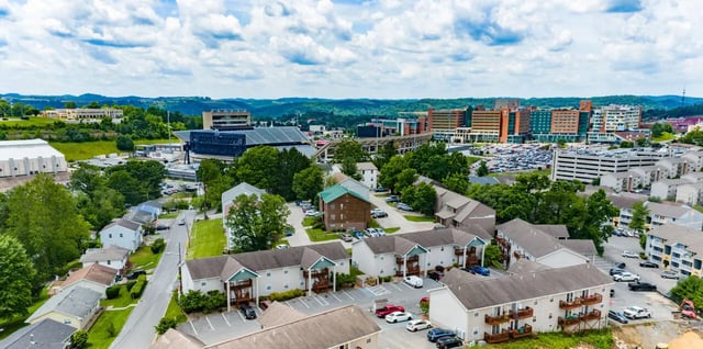 Apartment buildings with balconies and parking Exterior at Ashley Oaks Apartments in Morgantown Student Accommodation
