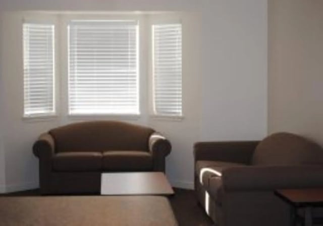 Two brown sofas a coffee table living room at Brighton Townhouses & Apartments in Rexburg Student Accommodation