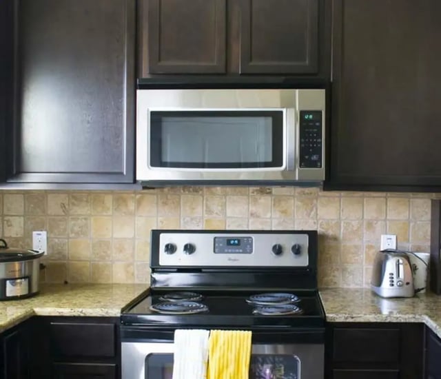 Microwave stove toaster granite countertop kitchen at The Estate on Third in Waco Student Accommodation