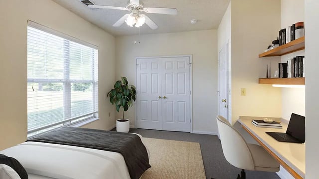 Bed desk chair plant double doors bedroom at Cape Trails in Cape Girardeau Student Accommodation