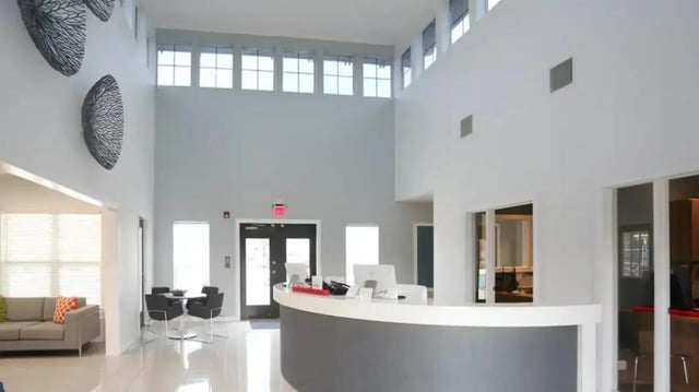 Reception desk computers doors and seating area lobby at Cape Trails in Cape Girardeau Student Accommodation