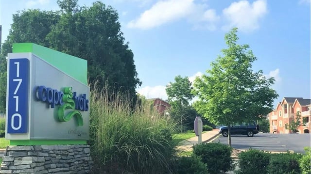 Signage for Cooper Trails apartment complex exterior at Cape Trails in Cape Girardeau Student Accommodation