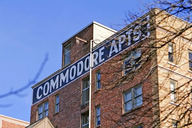 Commodore Apartments sign on brick building exterior at Commodore Duchess Apartments in Seattle Student Accommodation