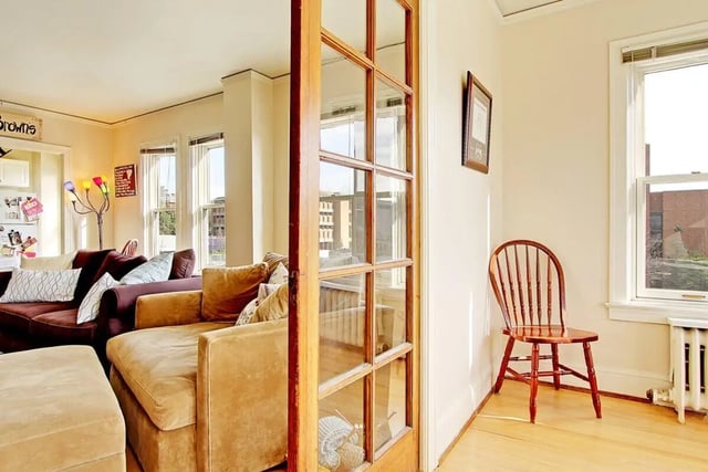 Sofa sectional ottoman french door wood chair living room at Commodore Duchess Apartments in Seattle Student Accommodation