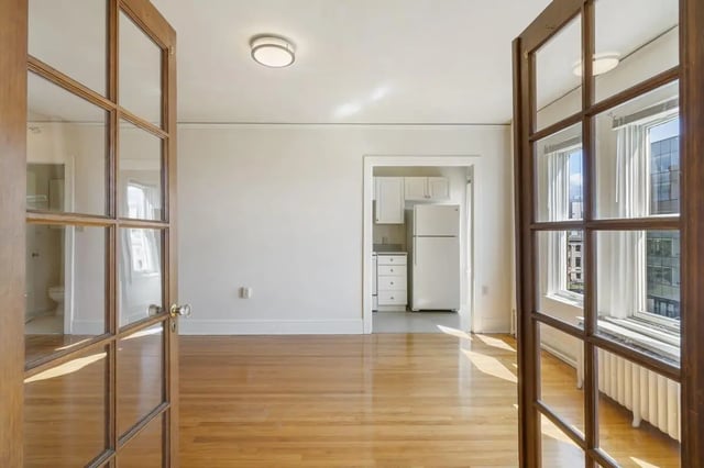 Open doors leading to kitchen bathroom and living room at Commodore Duchess Apartments in Seattle Student Accommodation