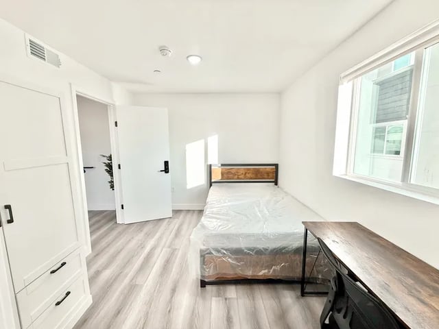 Bed desk wardrobe and closet bedroom at 1329 W 36th St in Los Angeles Student Accommodation
