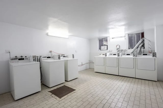 Washing machines and dryers laundry room at 1329 W 36th St in Los Angeles Student Accommodation