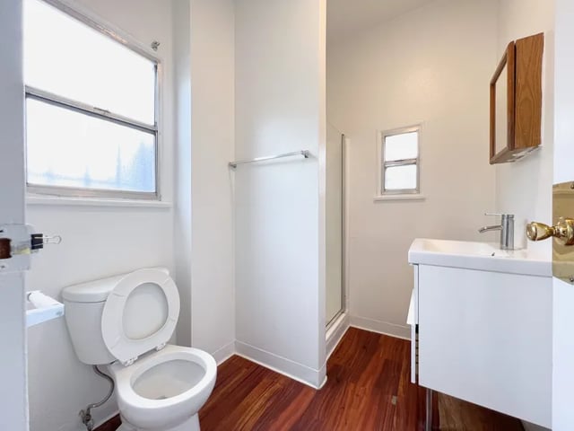 Toilet sink shower and medicine cabinet bathroom at 1329 W 36th St in Los Angeles Student Accommodation