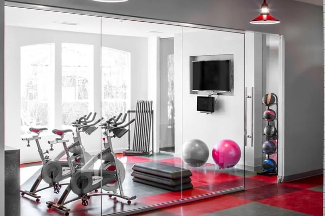 Spin bikes step benches medicine balls fitness room at The Scarlet in Lubbock Student Accommodation