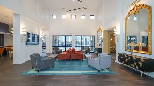 Chairs couches tables on rug communal area at The Domain at Columbia in Columbia Student Accommodation